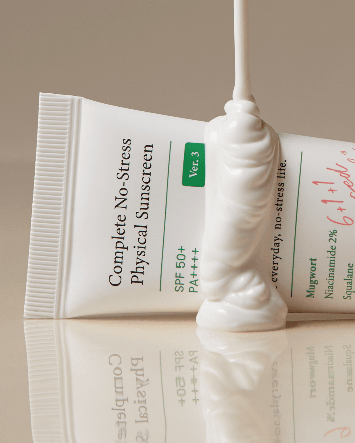 OTC version Complete No-Stress Physical Sunscreen V.3 being dispensed from the tube, showcasing its thick and nourishing formula for daily sun protection.