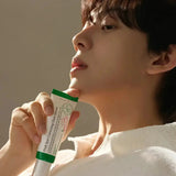Person holding Dark Spot Correcting Glow Serum, highlighting its brightening and hydrating benefits for a radiant complexion.