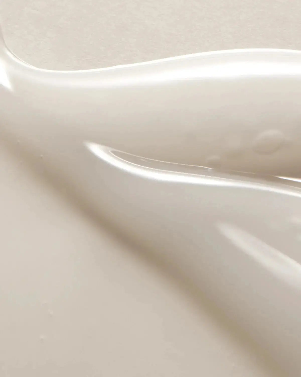 Close-up texture of the Glass Skin Duo serum, showcasing its smooth, hydrating formula for a glowing, even-toned complexion.