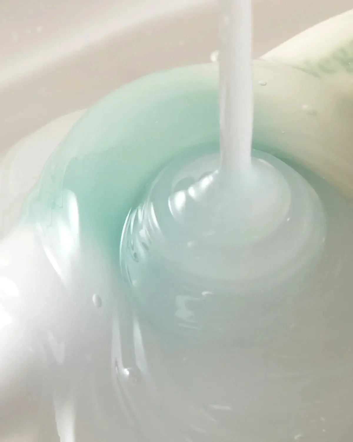 Serum being dispensed, highlighting the lightweight, nourishing formula of the Glass Skin Duo for deep hydration and skin rejuvenation.